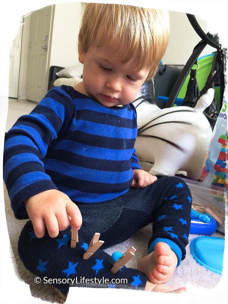 15 month toddler activity: Boy pulling pegs off