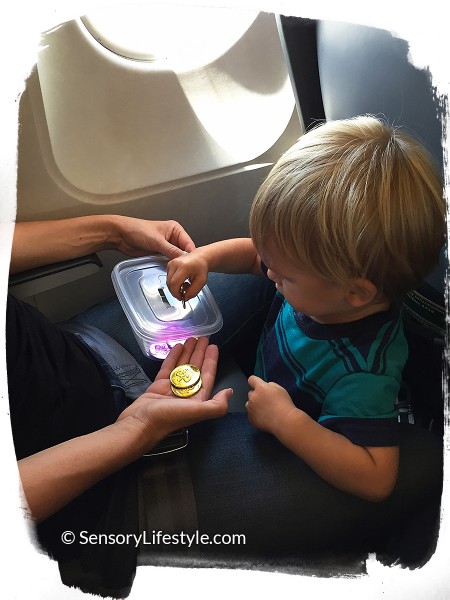 Travel activities for toddler: Playing with coins