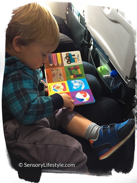 Travel activities for toddler: Reading a book