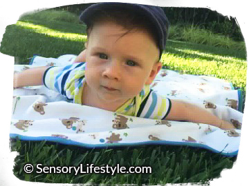 3 month baby activities: Tummy Time on the grass