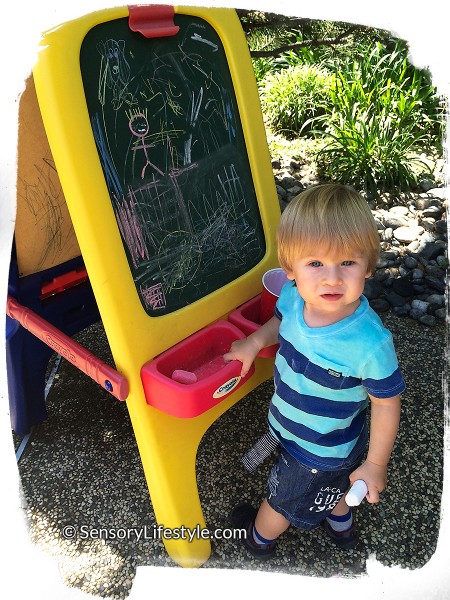 18 month old toddler activities: Josh drawing with chalk