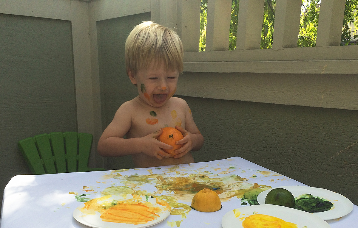 Josh painting with fruit