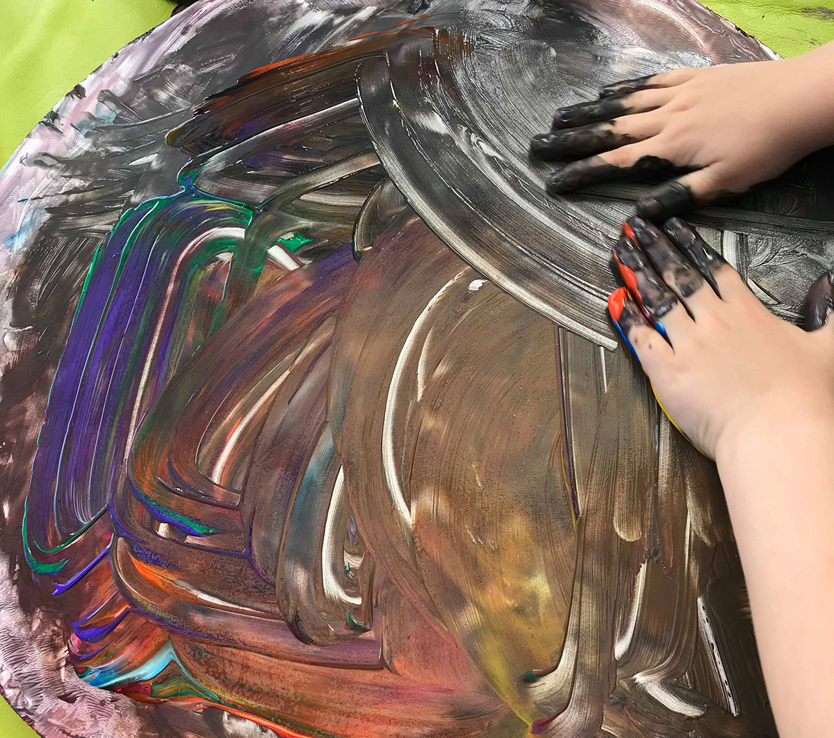 Preschooler finger painting activity