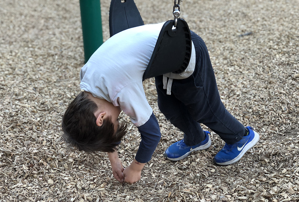 Upside down on swing